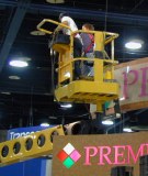 Two people high up in a cherry-picker