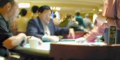 People sitting at a blackjack table