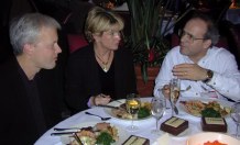 Three eating and talking