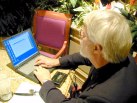 John at late dinner typing seen from the rear