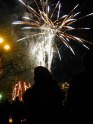 Fireworks in the sky past outlines of people