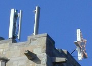 Two vertical antennas and a Christmas star on the roof