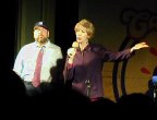 Guy in baseball hat and woman singing