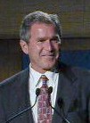 George W smiling on the podium