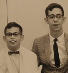 Jonathan in bow tie smiling and me in narrow tie and jacket (about 11 and 15 years old, respectively)