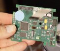 Circuit board held in hand