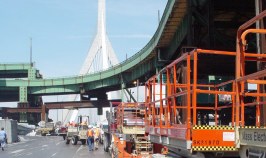 More equipment, green onramp up high, inverted Y holding up cables of the bridge