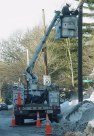 Truck with cherry picker and orange cones