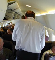Bending down to walk down aisle