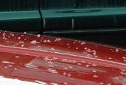 Hail on hood of a car