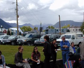 Sitting around with mountains in the background